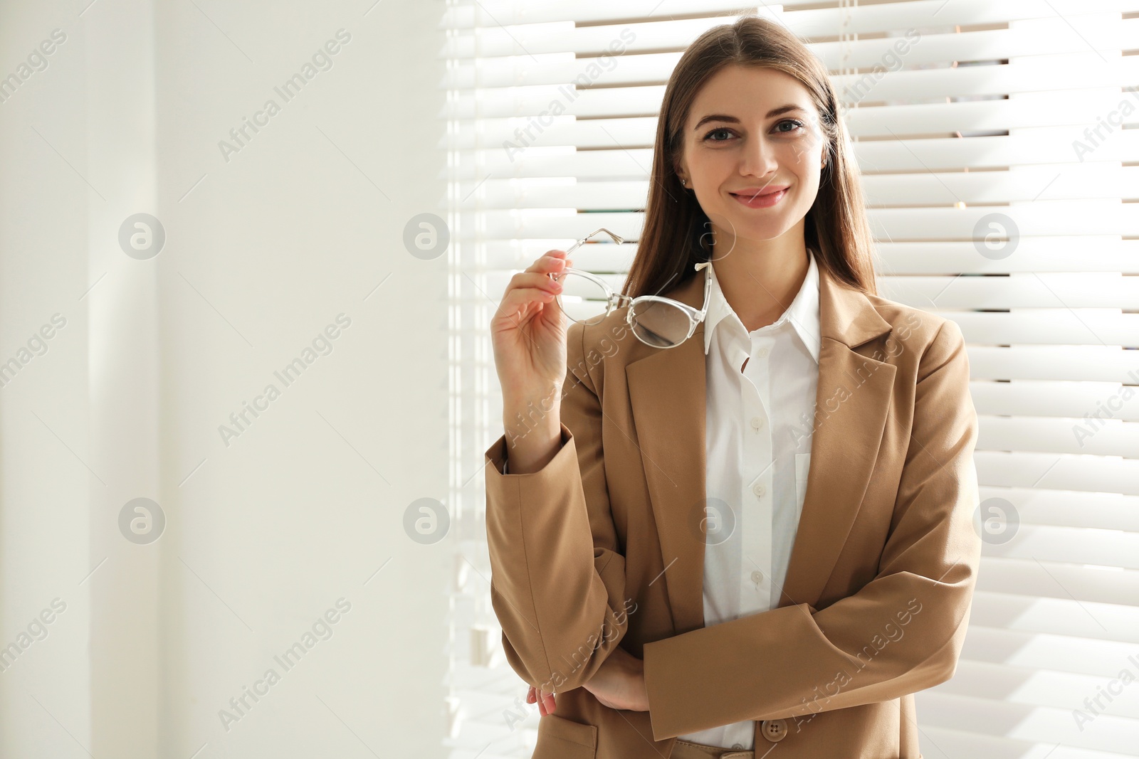 Photo of Portrait of beautiful young businesswoman in office