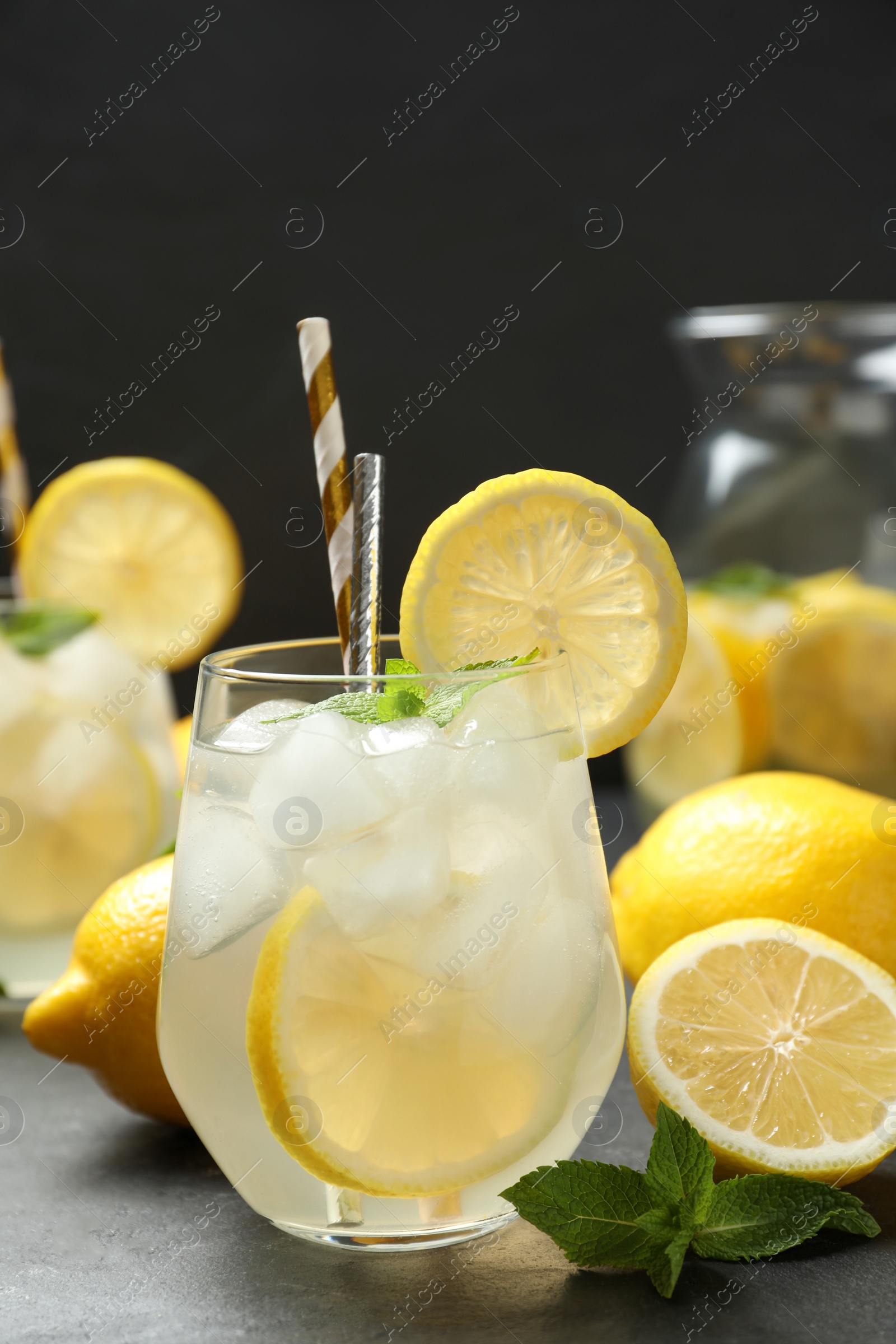 Photo of Natural lemonade with mint on grey table. Summer refreshing drink