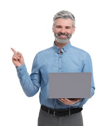 Mature businessman in stylish clothes with laptop on white background