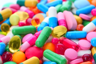 Photo of Assorted pills as background, closeup. Medical treatment