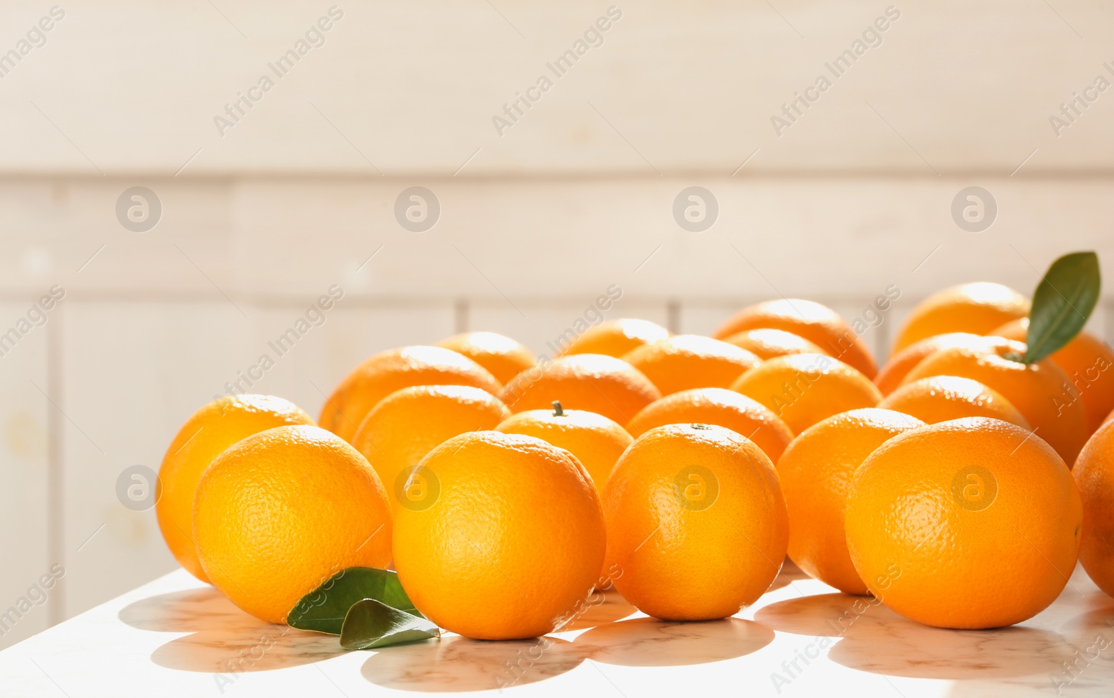 Photo of Fresh juicy oranges on table, space for text. Healthy fruits