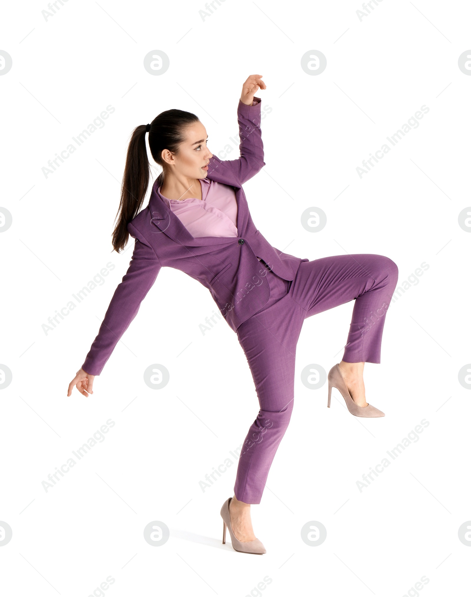 Photo of Businesswoman attracted to magnet on white background