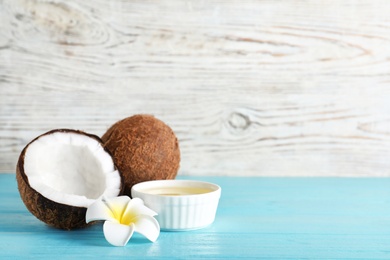 Photo of Composition with natural organic coconut oil on table. Space for text