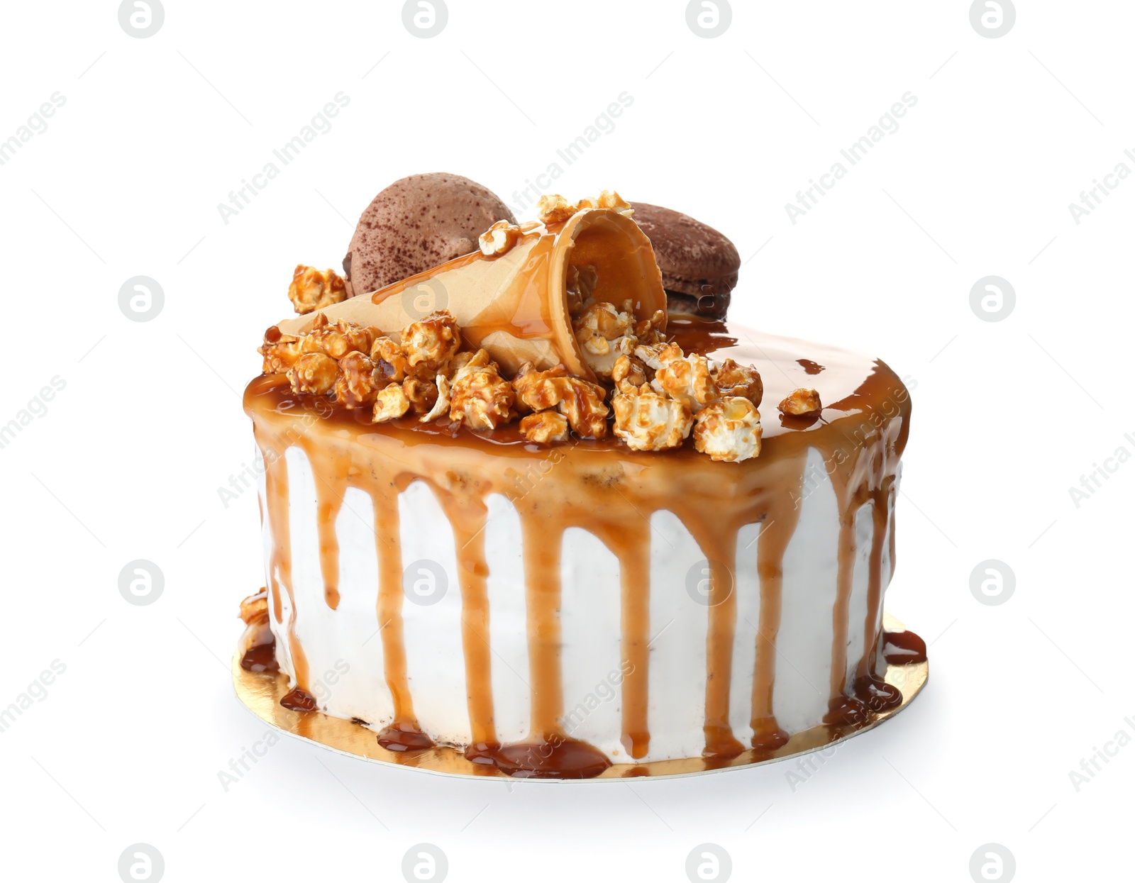 Photo of Delicious homemade cake with caramel sauce and popcorn on white background