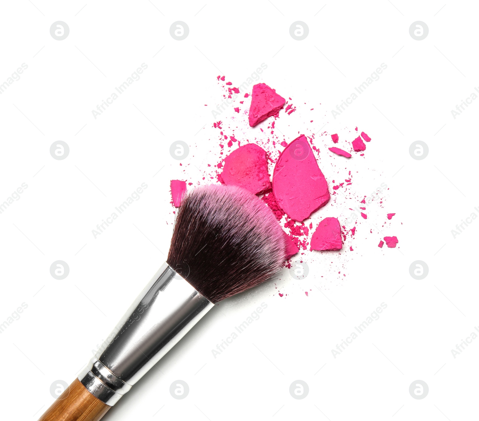 Photo of Makeup brush and crushed cosmetic product on white background, top view