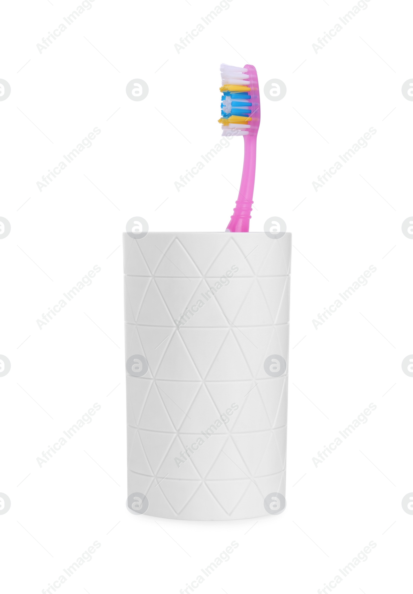 Photo of One plastic toothbrush in holder isolated on white