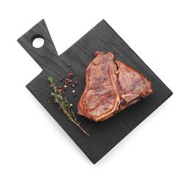 Delicious fried beef meat, thyme and peppercorns isolated on white, top view