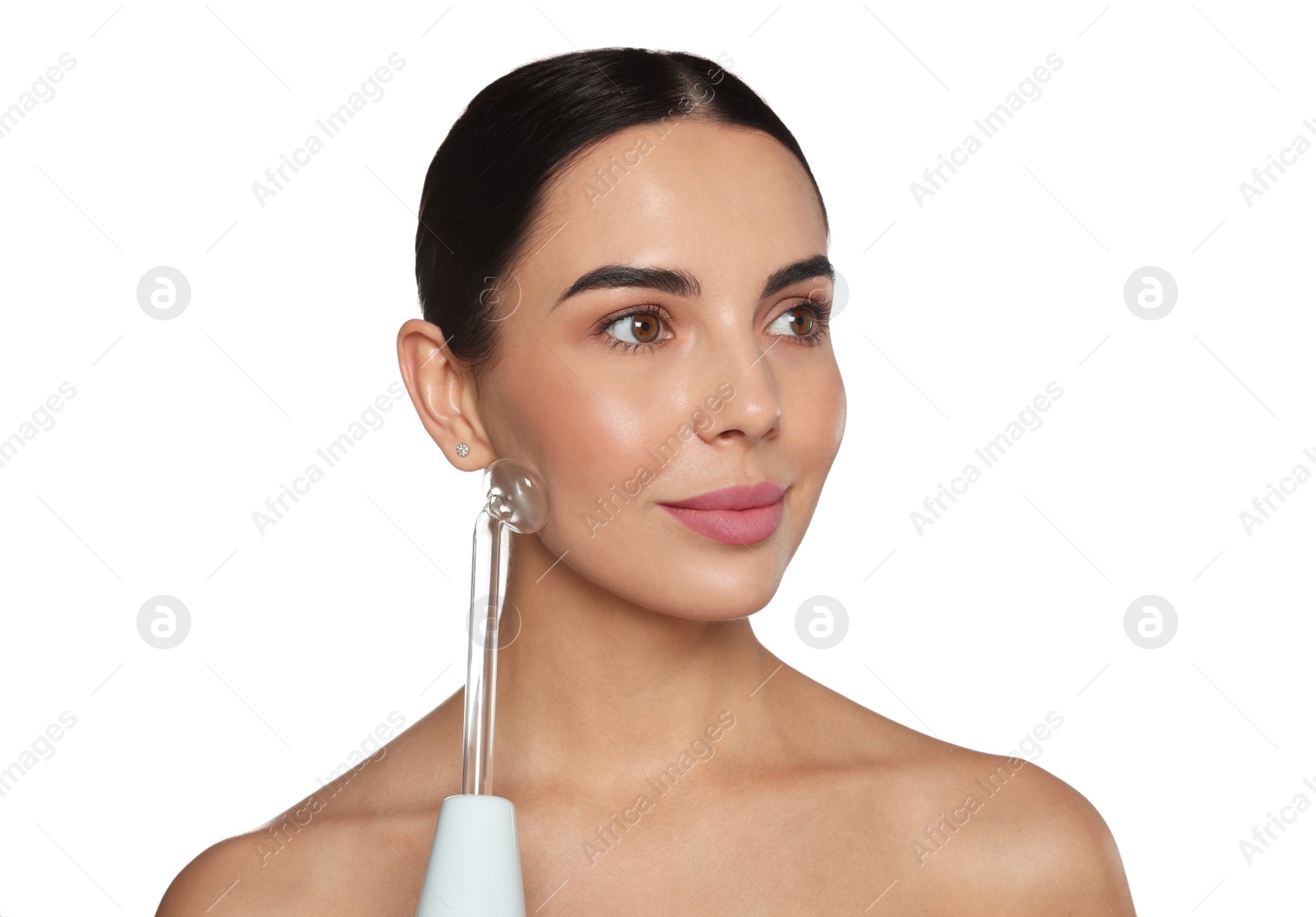 Photo of Woman using high frequency darsonval device on white background