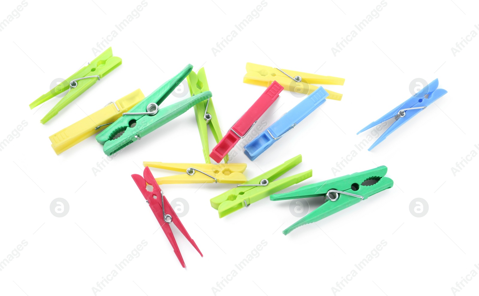 Photo of Colorful plastic clothespins on white background, above view