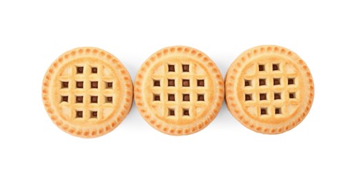 Photo of Tasty sandwich cookies with cream isolated on white, top view