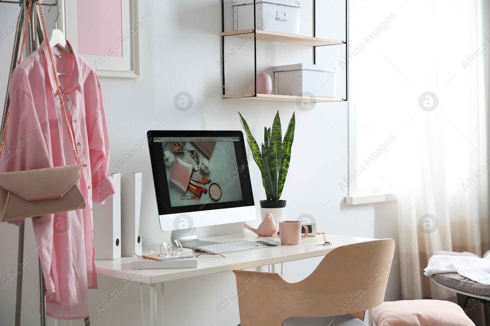 Photo of Comfortable workplace with computer on desk in home office