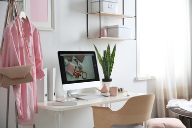 Comfortable workplace with computer on desk in home office