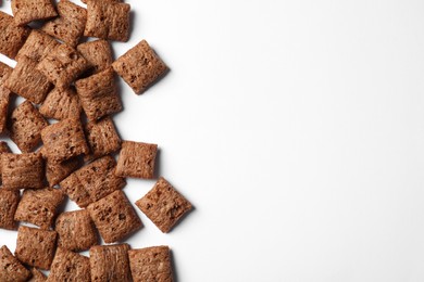 Delicious chocolate corn pads on white background, top view