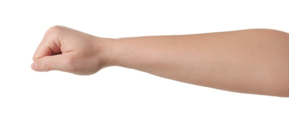 Playing rock, paper and scissors. Woman showing fist on white background, closeup