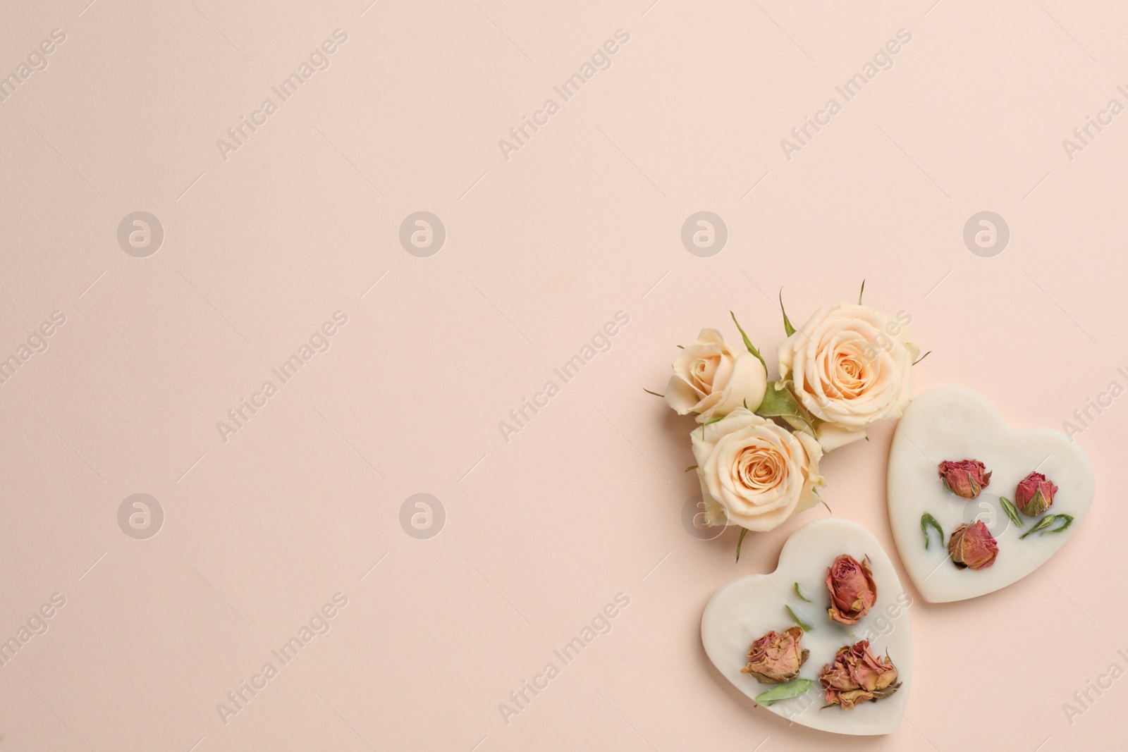 Photo of Flat lay composition with scented sachets on beige background, space for text