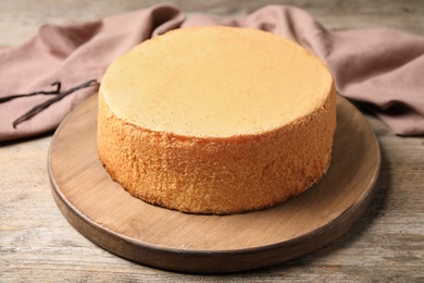 Photo of Delicious fresh homemade cake on wooden table