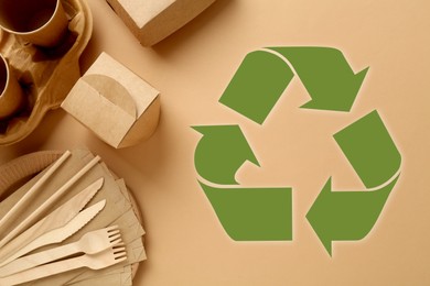 Image of Flat lay composition of eco friendly products and recycling symbol on beige background