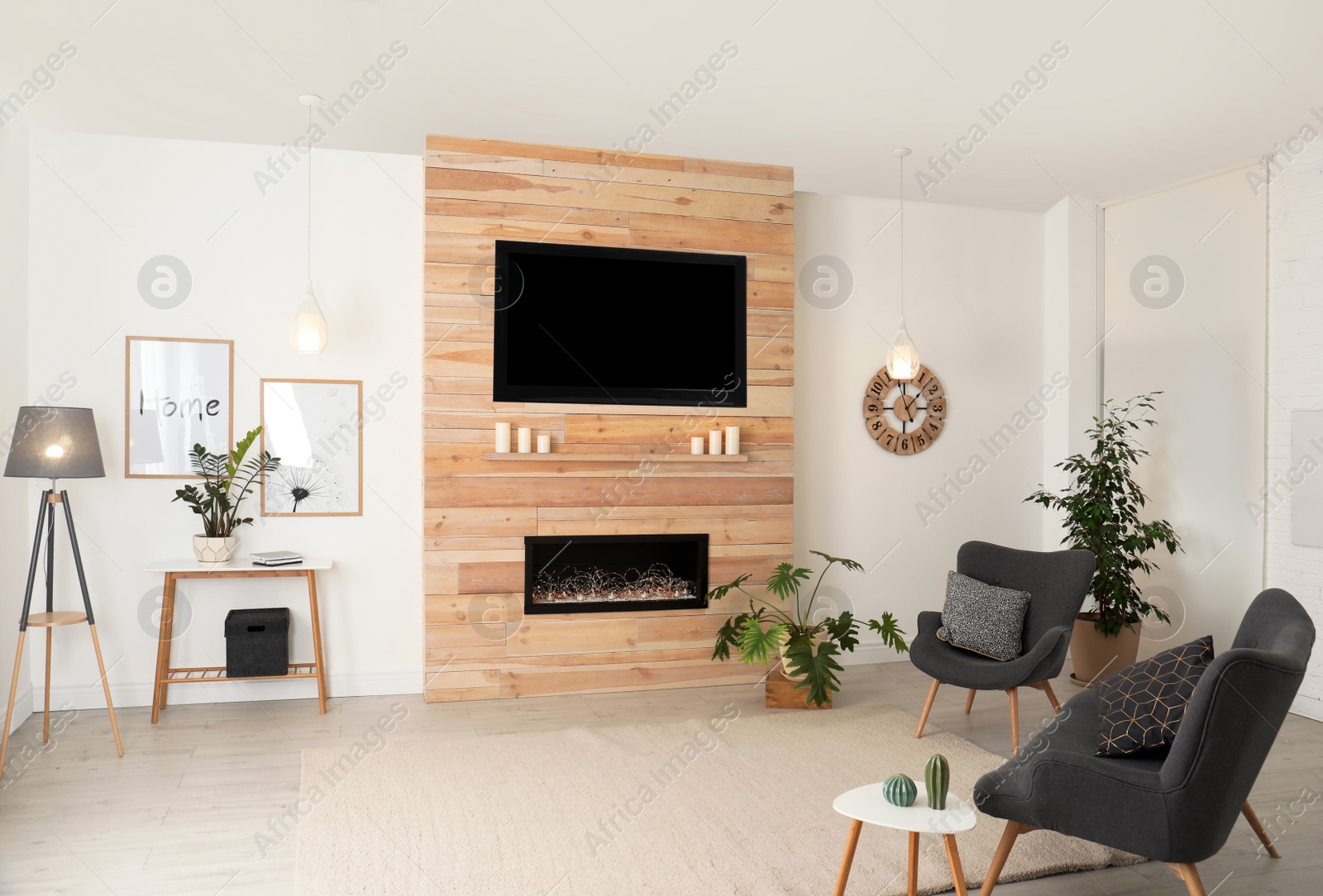 Photo of Living room interior with decorative fireplace in wooden wall