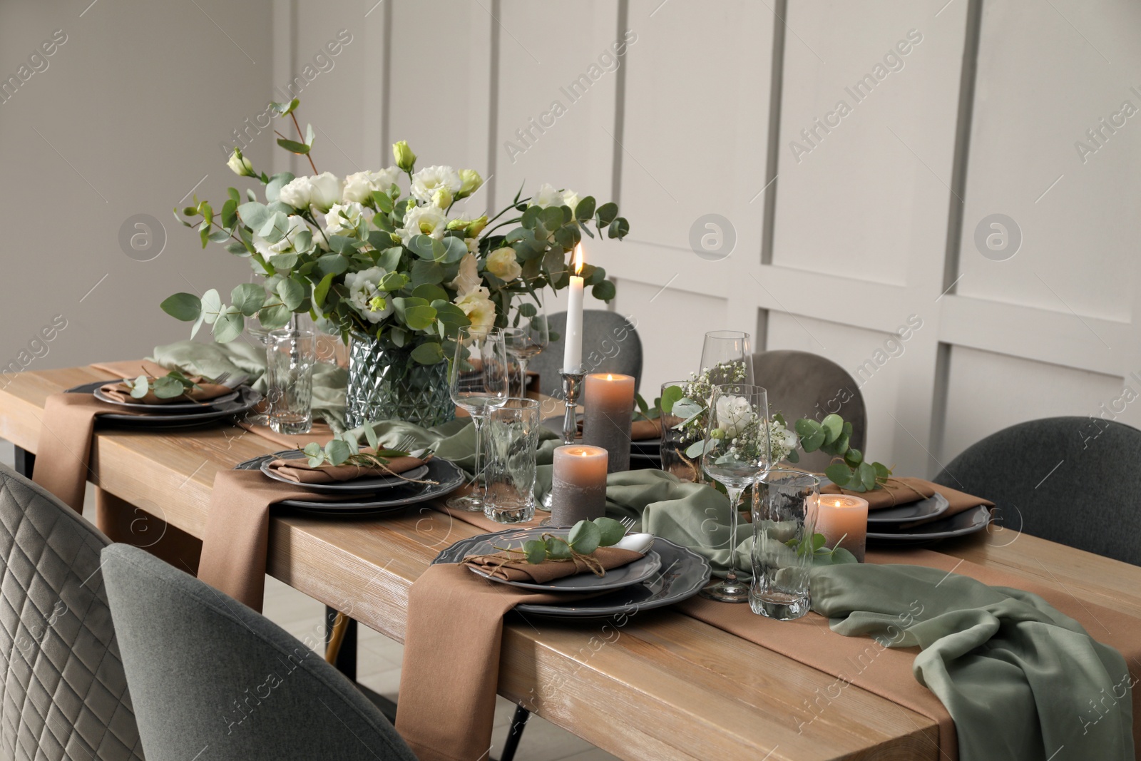 Photo of Festive table setting with beautiful floral decor indoors