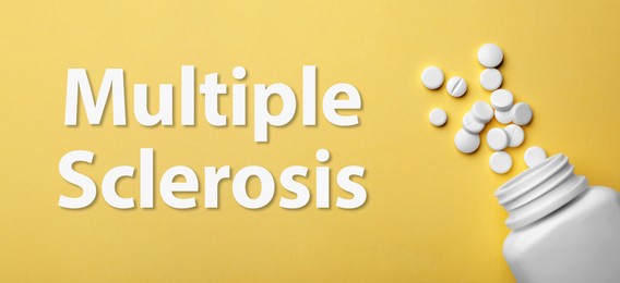 Image of Multiple sclerosis treatment. Bottle with different pills on yellow background, flat lay