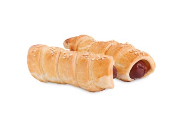Photo of Delicious homemade sausage rolls isolated on white