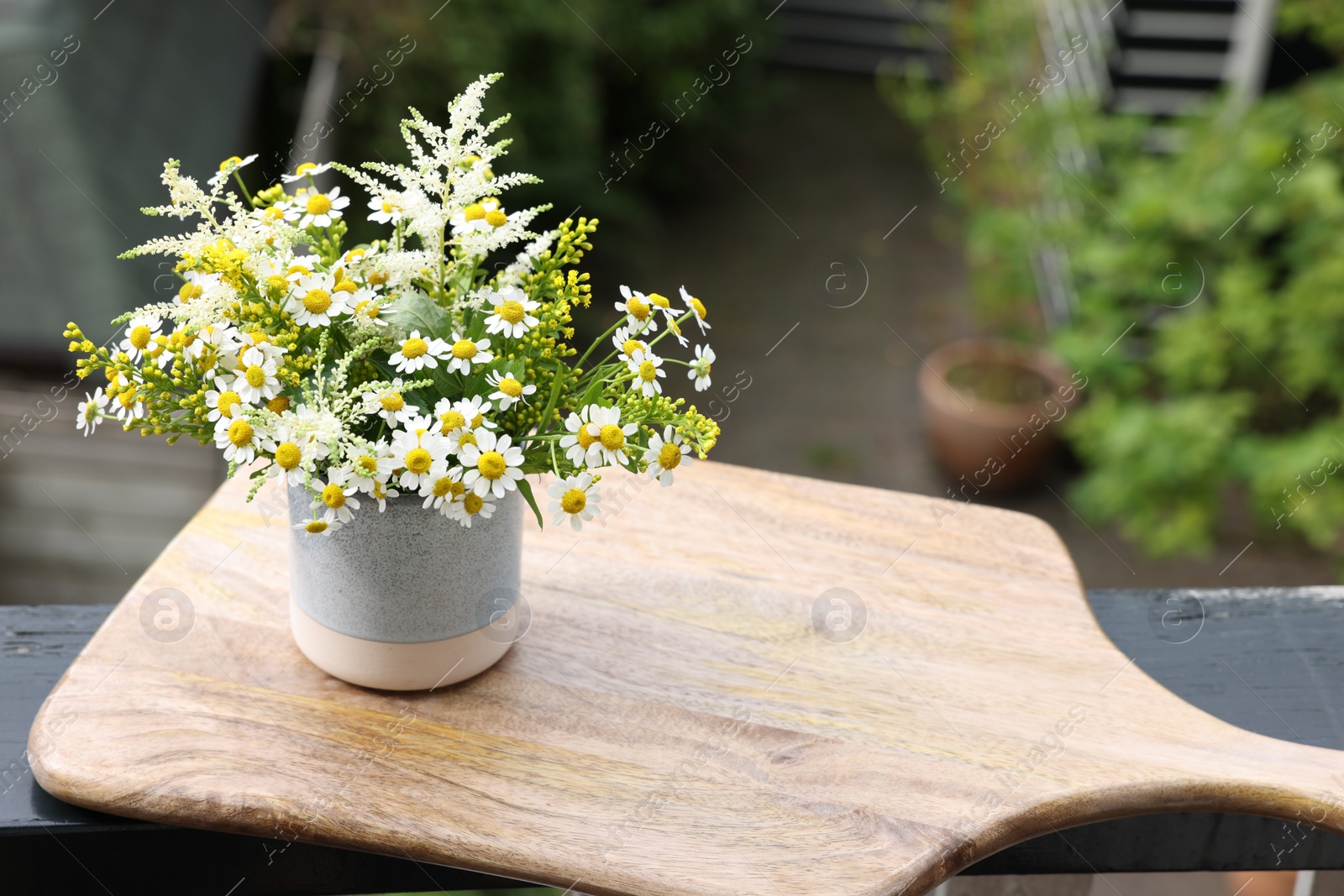 Photo of Bouquet of fresh flowers outdoors. Space for text