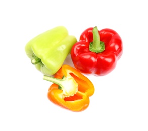 Whole and cut bell peppers on white background, top view