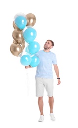 Photo of Young man with air balloons on white background