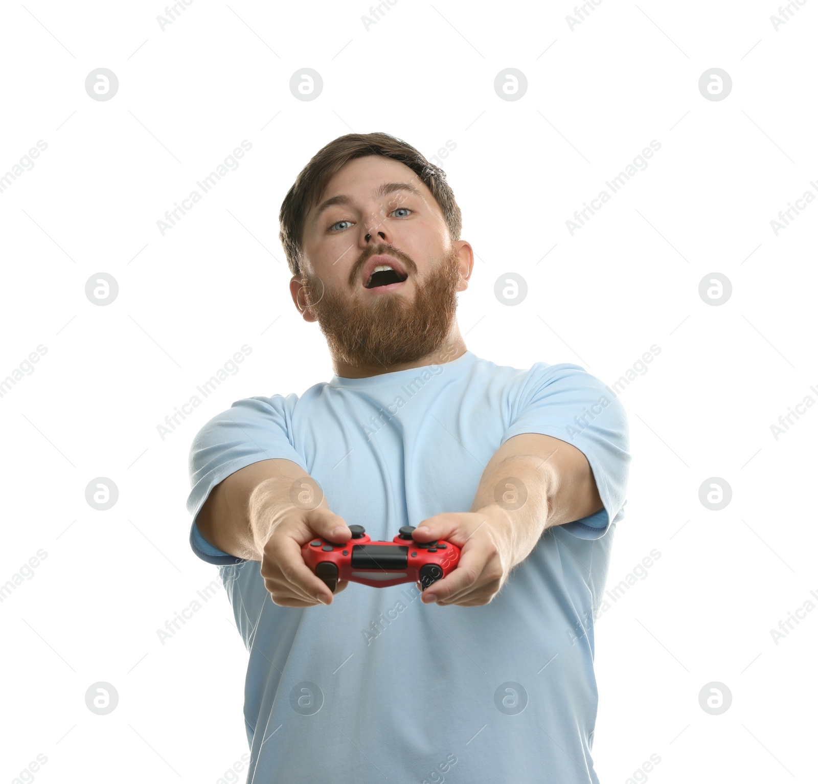 Photo of Surprised man playing video game with controller on white background