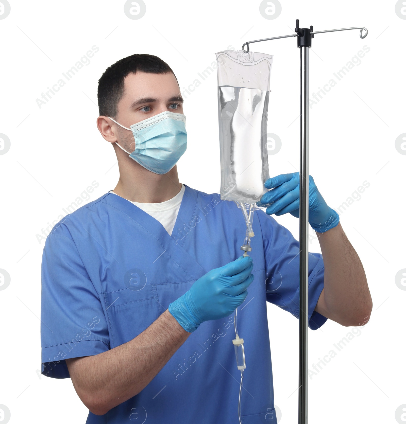 Photo of Nurse setting up IV drip on white background