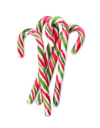 Photo of Sweet Christmas candy canes on white background