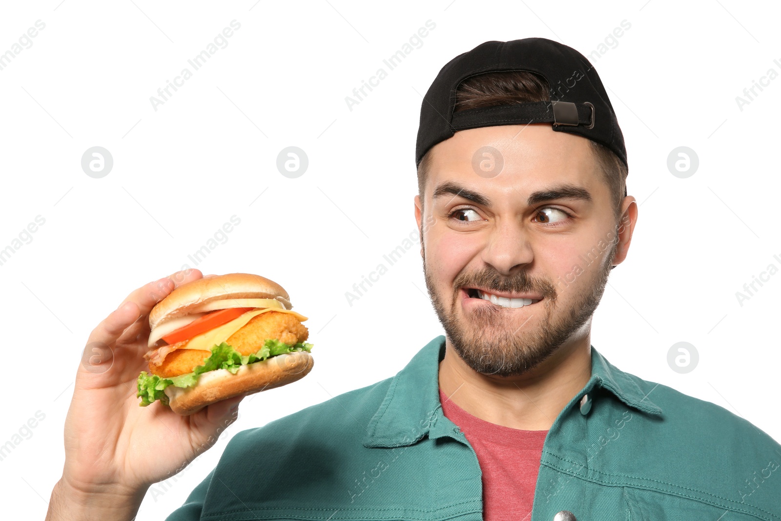 Photo of Handsome man with tasty burger isolated on white