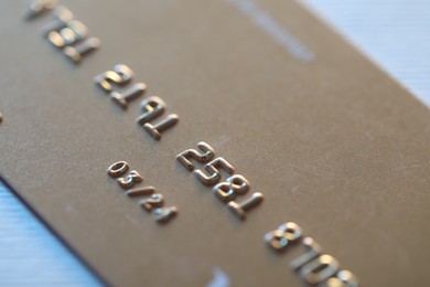 Photo of One credit card on light background, macro view