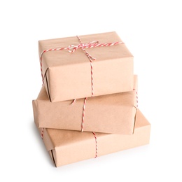 Photo of Beautifully wrapped gift boxes on white background