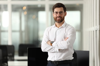 Portrait of smiling man in office, space for text. Lawyer, businessman, accountant or manager