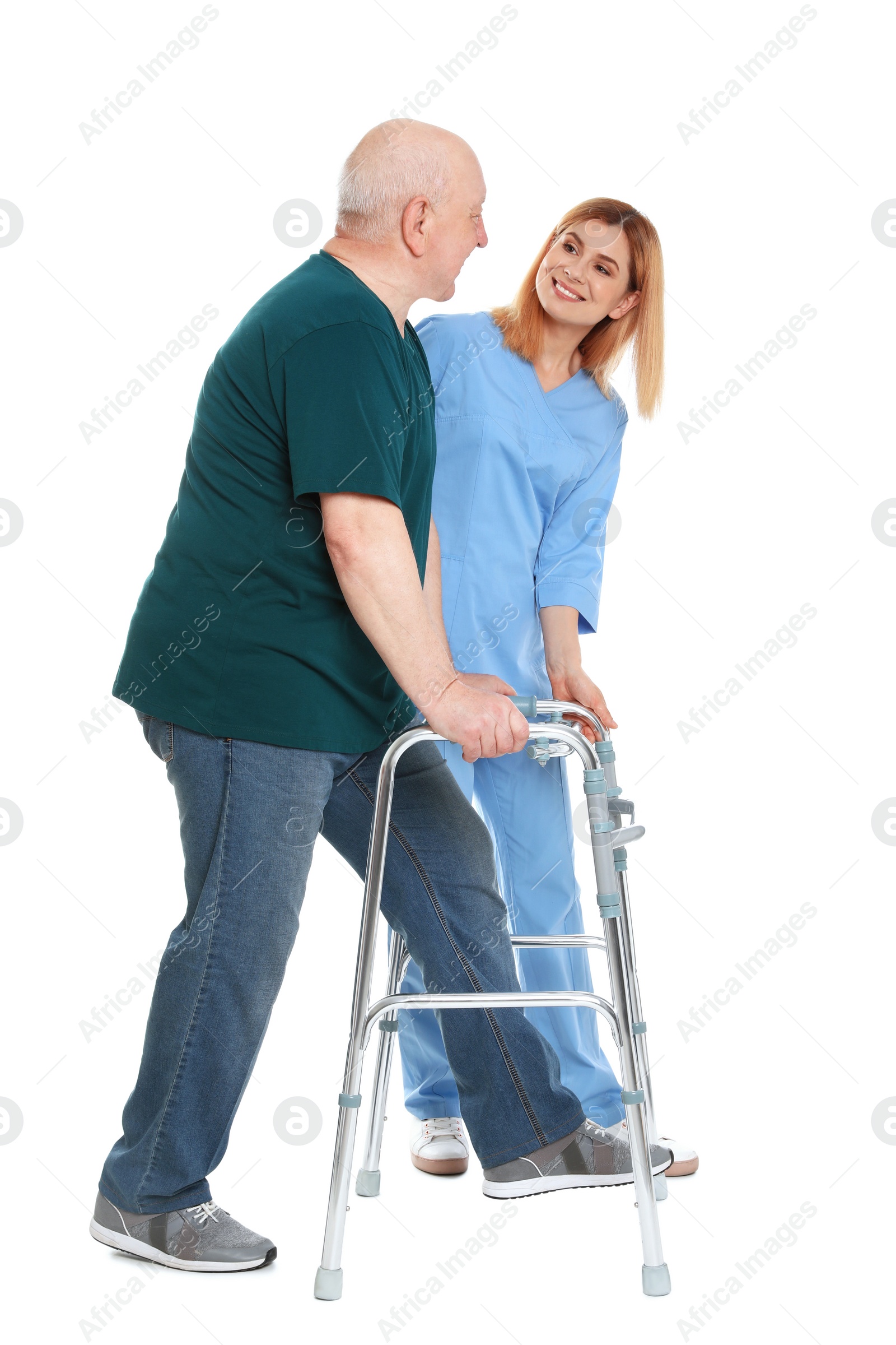 Photo of Caretaker helping elderly man with walking frame on white background