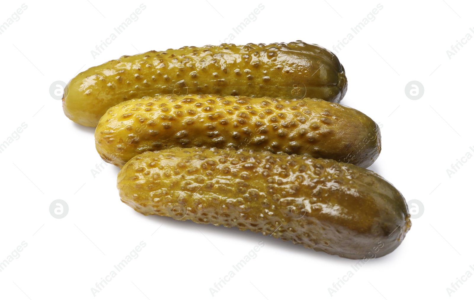 Photo of Pile of tasty pickled cucumbers isolated on white