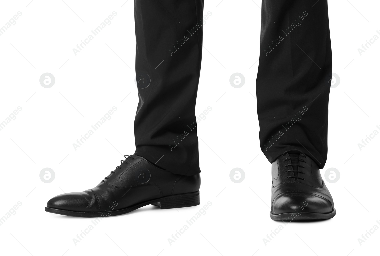 Photo of Businessman in leather shoes on white background, closeup