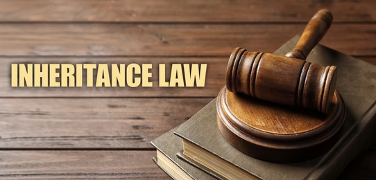 Image of Phrase Inheritance law and wooden gavel with books on wooden background, banner design