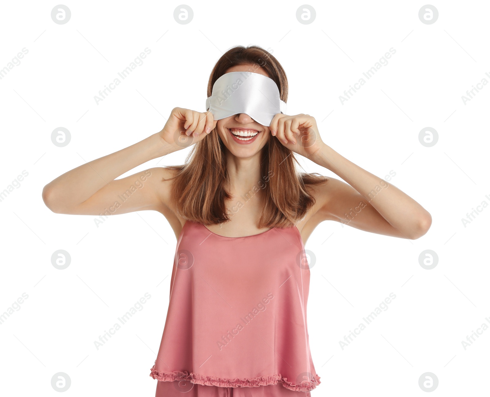 Photo of Beautiful woman wearing pajamas and sleep mask on white background. Bedtime