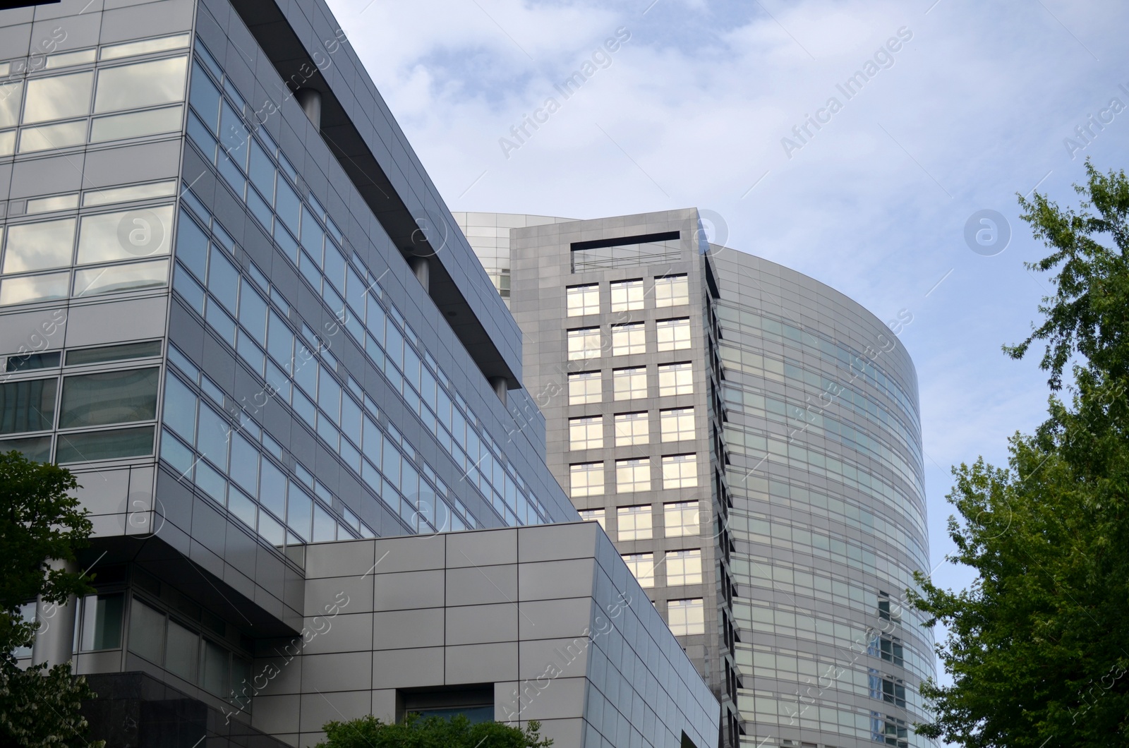 Photo of Exterior of beautiful modern skyscraper against blue sky