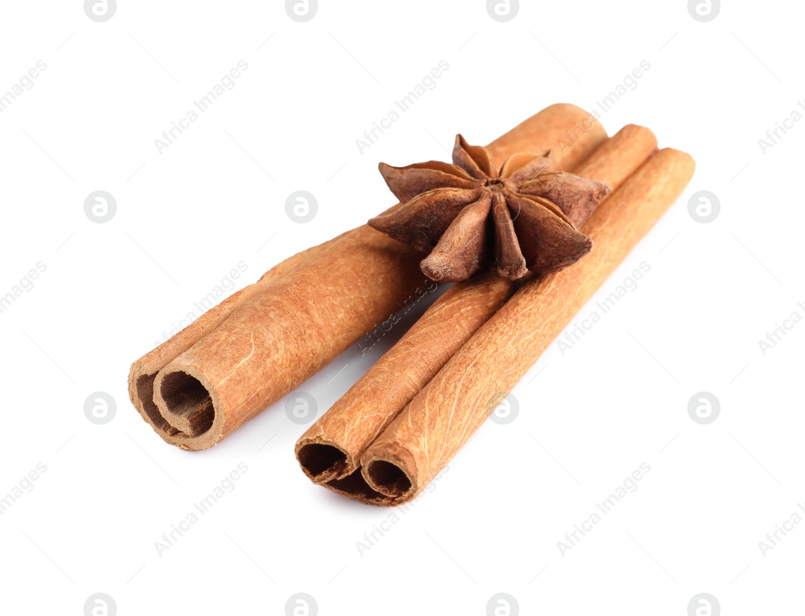 Photo of Cinnamon sticks and anise star isolated on white