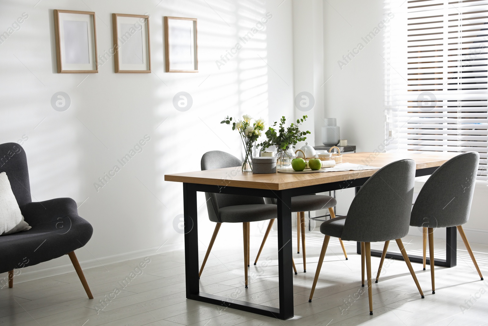 Photo of Stylish room interior with table and chairs. Idea for design