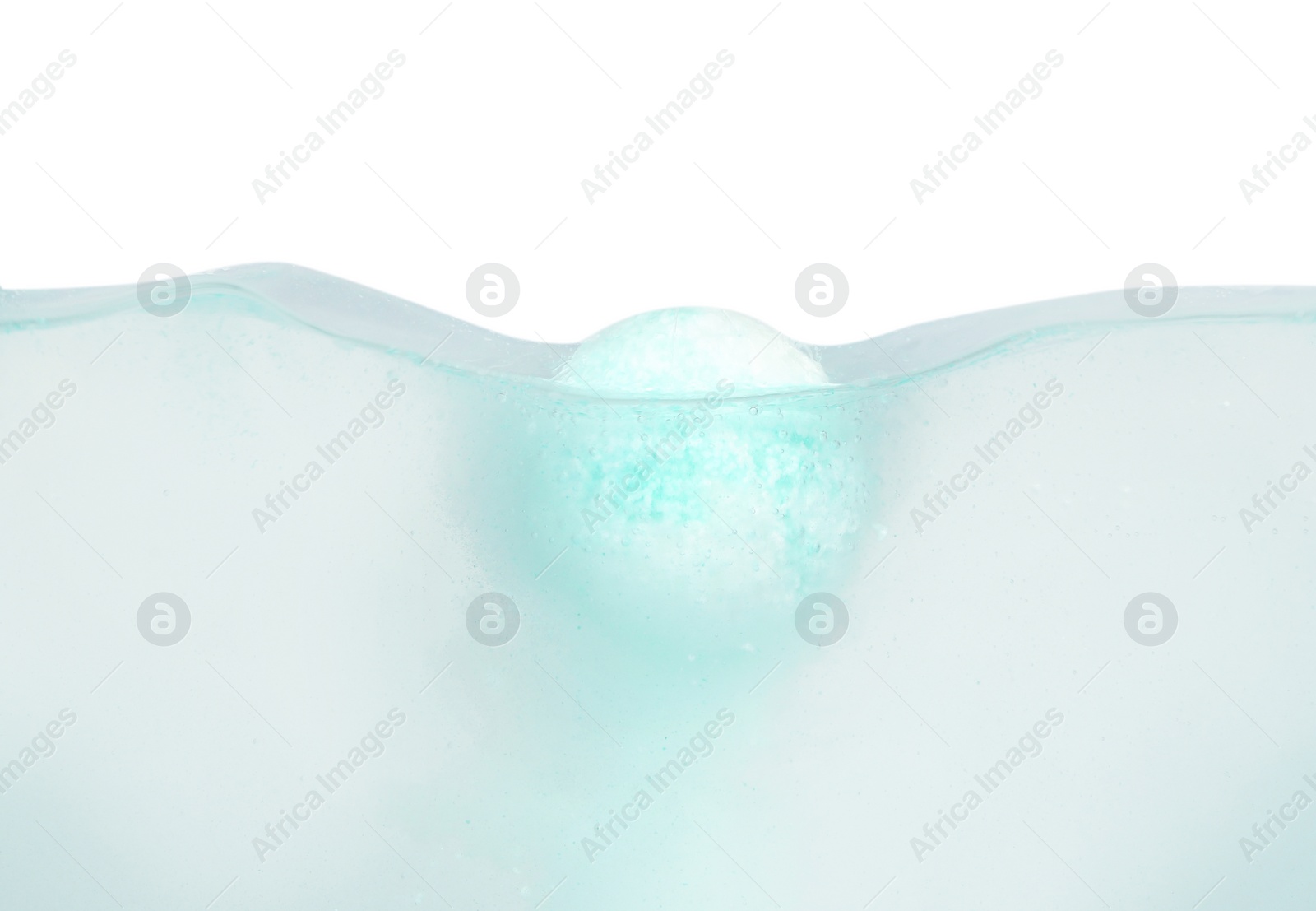 Photo of Bath bomb in water on white background