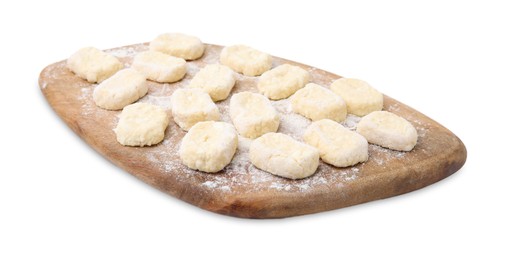 Photo of Making lazy dumplings. Wooden board with cut dough and flour isolated on white