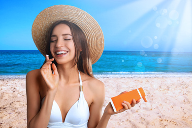 Image of Young woman applying sun protection cream at beach