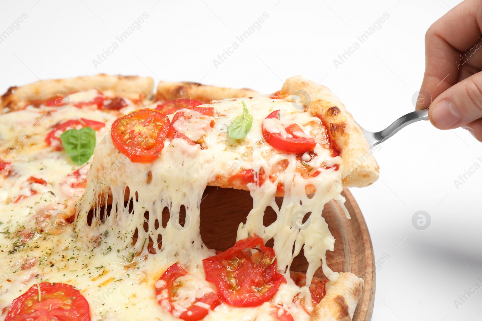 Photo of Woman taking slice of delicious pizza Margherita on white background, closeup