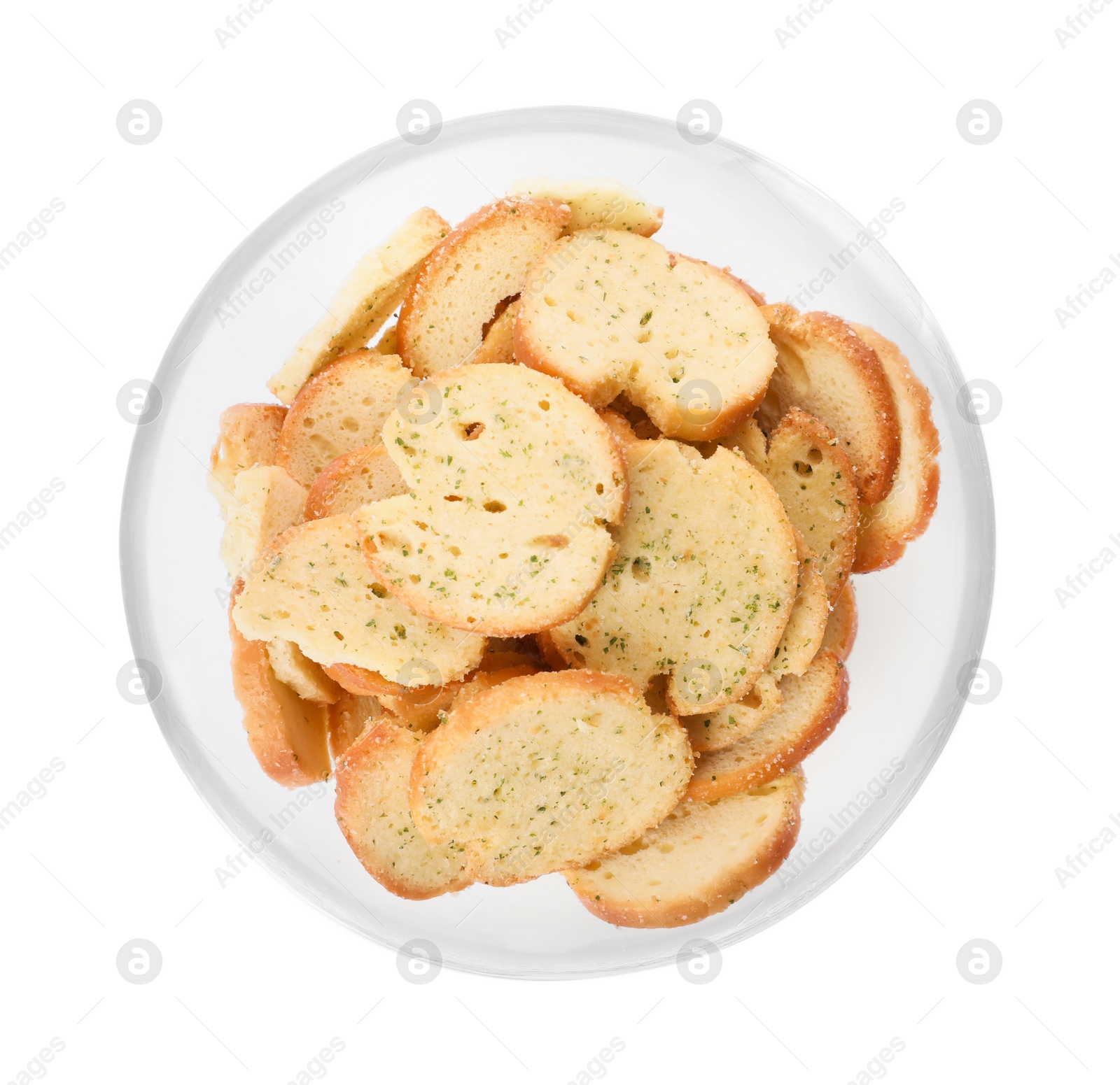 Photo of Crispy rusks with seasoning in bowl isolated on white, top view