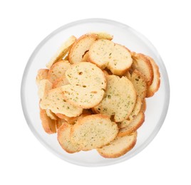 Photo of Crispy rusks with seasoning in bowl isolated on white, top view