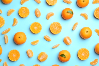 Photo of Composition with tangerines on color background, flat lay